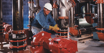 Technician repairing a fires sprinkler system